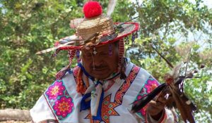 HuicholEncounter2 Huichol man dressed in colorful costume