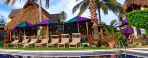 villa-bella-la-cruz-de-huanacaxtle Poolside lawn chairs at Villa Bella Hotel in La Cruz de Huanacaxtle Riviera Nayarit Mexico